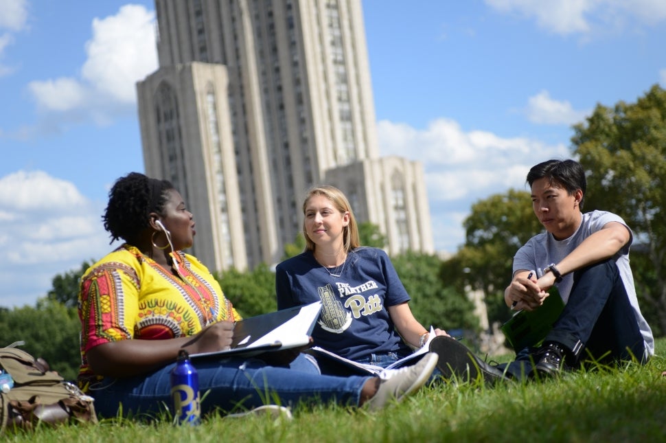 Pitt students in front of Cathedral of Learning