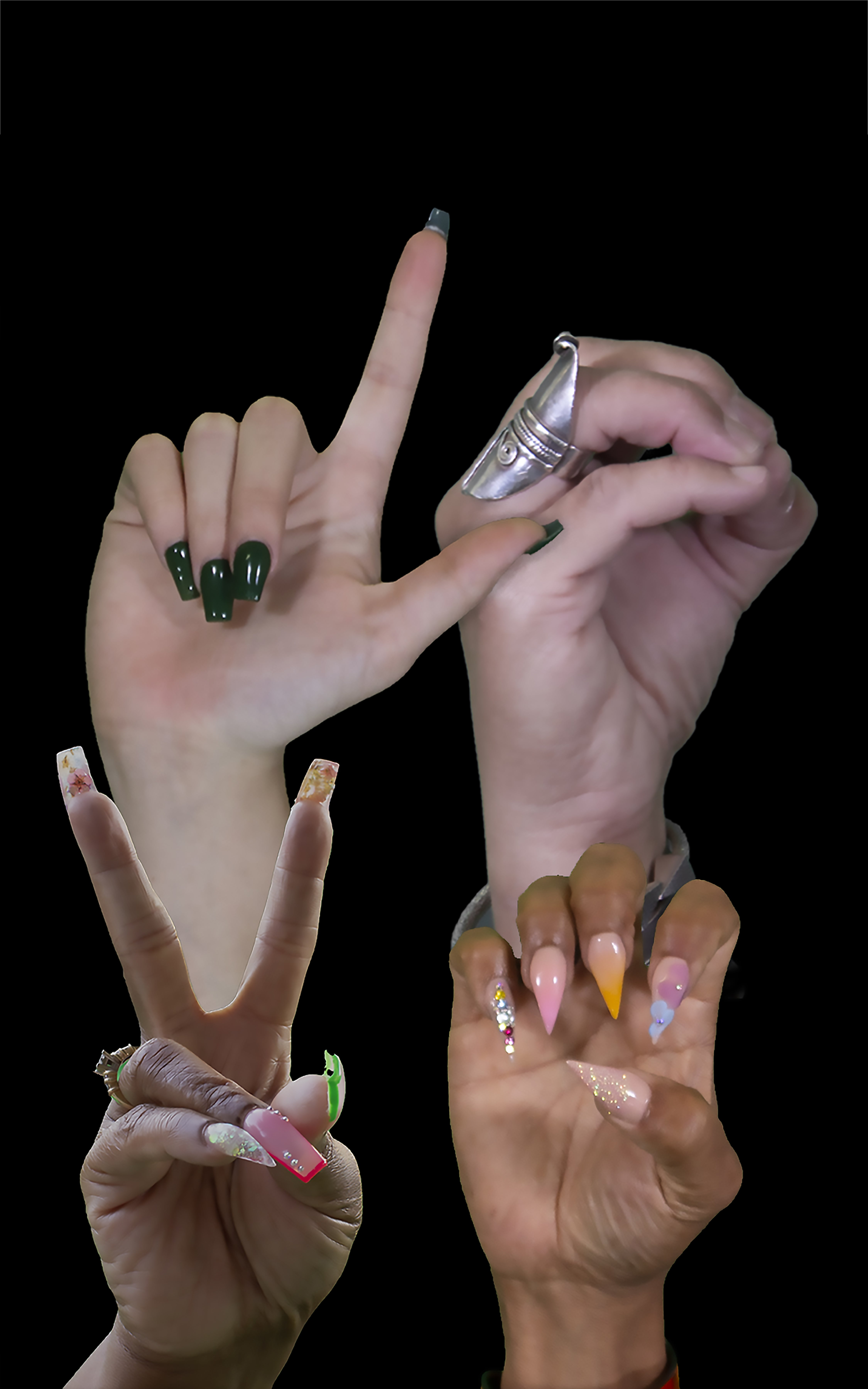 Four hands, each of varying skin tone, each using ASL to sign a different letter, spelling the word “Love”. The hands are adorned by rings and acrylic nail art